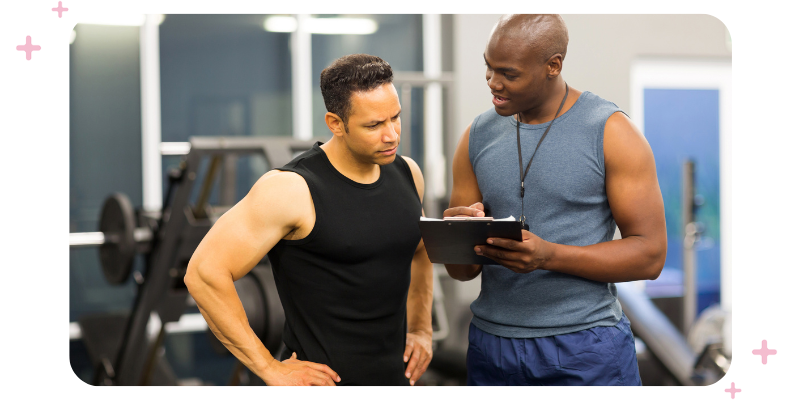 Gym instructor talking one on one to a customer