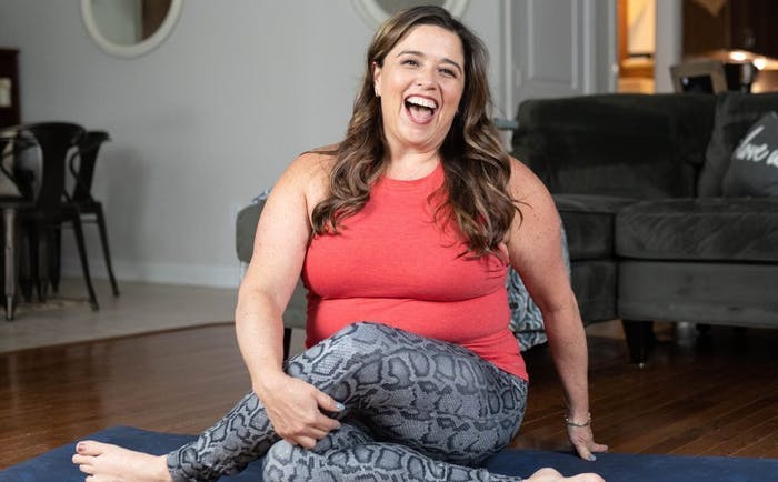 Kelly practicing yoga at home