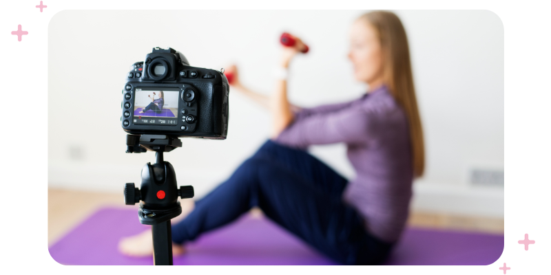 A fitness influencer in front of a camera.