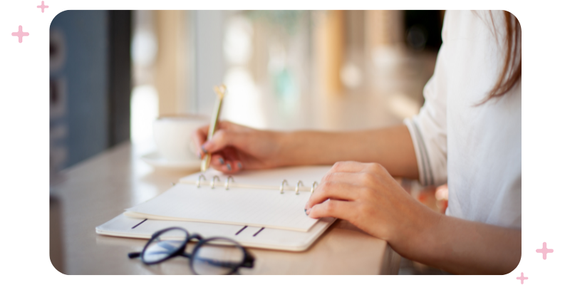 A woman writing in her diary.