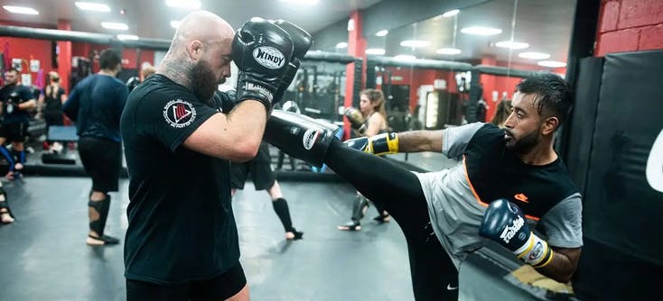 A kickboxing training session in a martial arts school