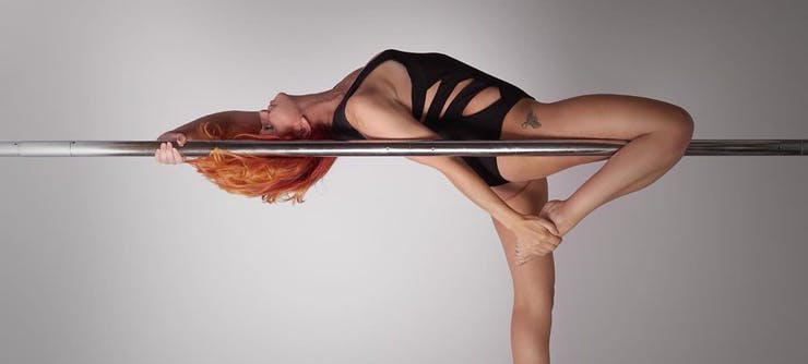 Bexiita, owner of Revved Up Pole teaching a pole class