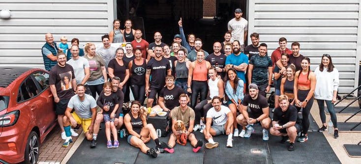 Members of CrossFit 13 assemble for a group photo