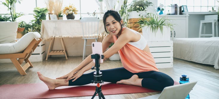 woman taking an online fitness class