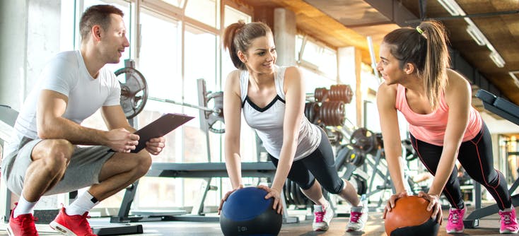 a personal trainer and two clients