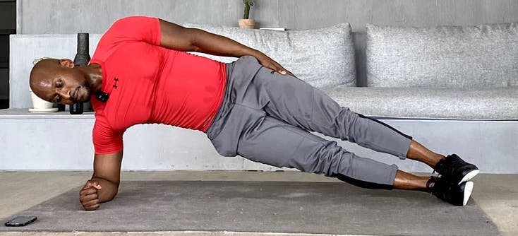 Personal trainer, Jason Altidor, doing a side plank