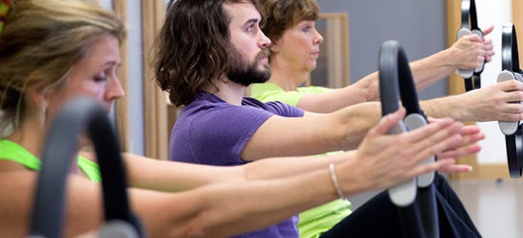 image of karen grinter's son daniel teaching a Pilates class