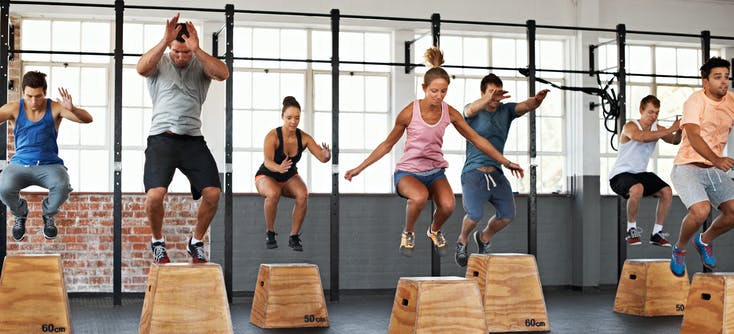 fitness class jumping on boxes