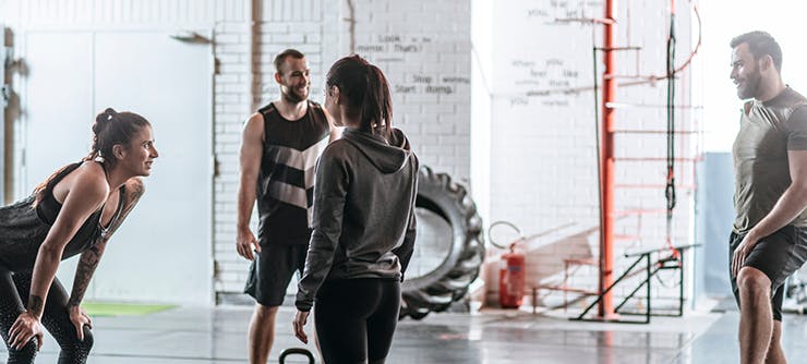 gym owner discussing payment options with customers