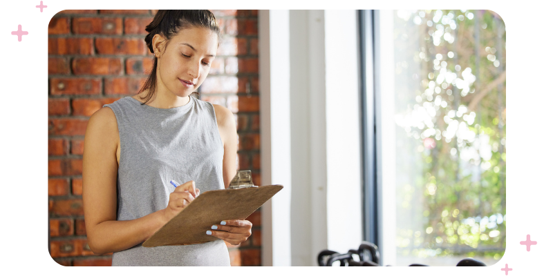 A gym owner with a clipboard checking items off.