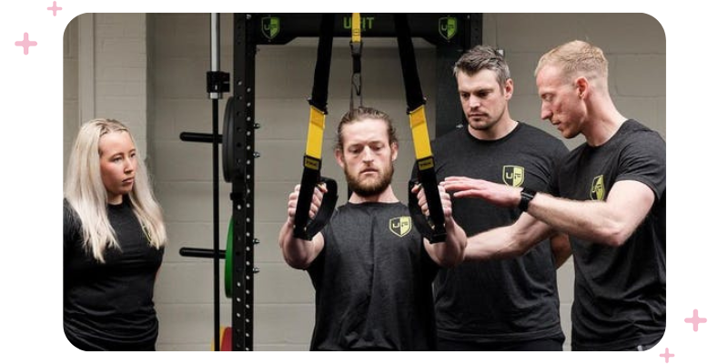 A team of fitness instructors training together