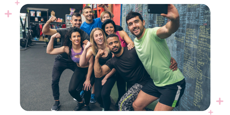 Friends at the gym taking a selfie.