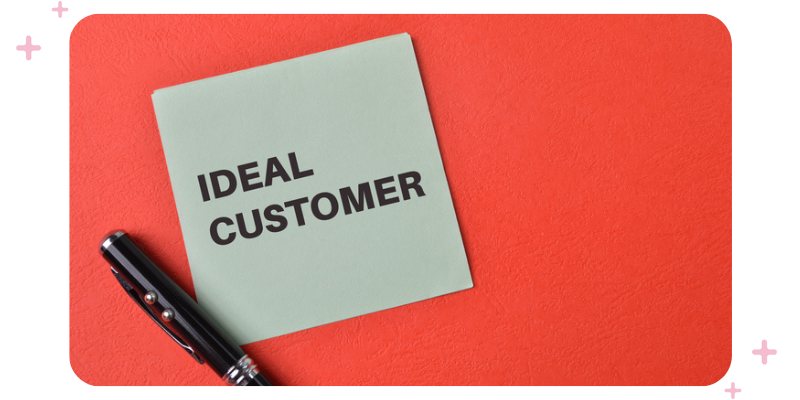 A post-it note that reads "Ideal customer", with a pen next to it.