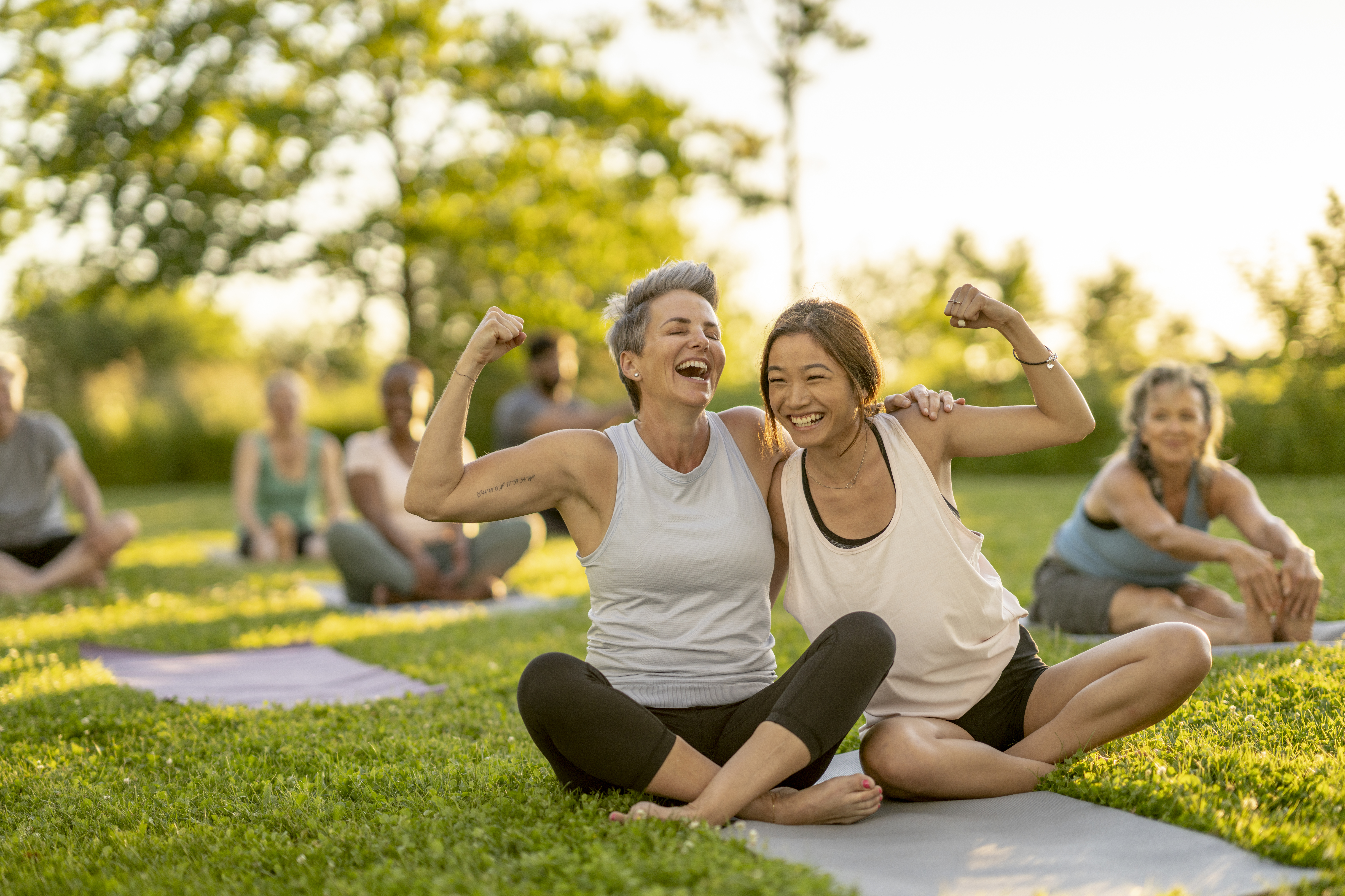 Women doing yoga in the park.