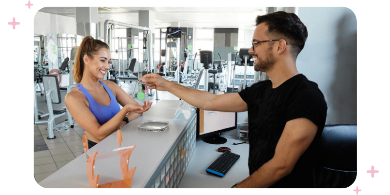 A woman at the reception desk at the gym.