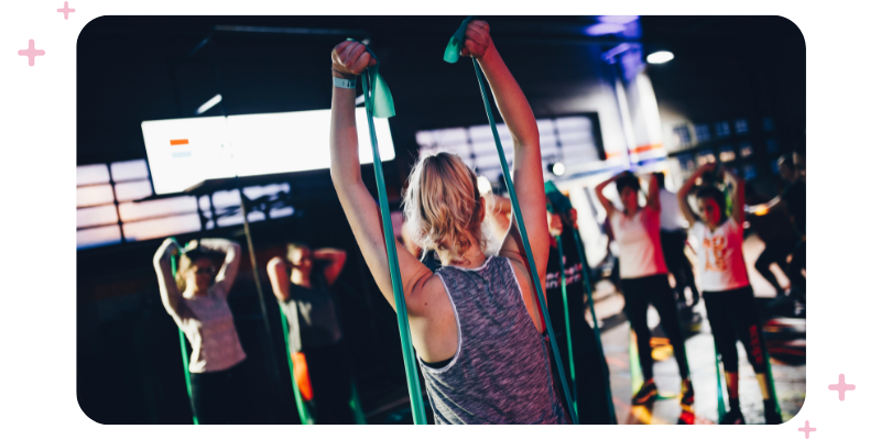 A fitness class with resistance bands.